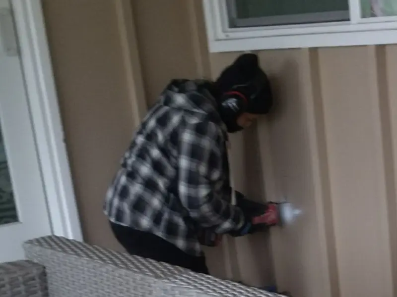 Professional electrician installing an exterior outlet in Blackstone